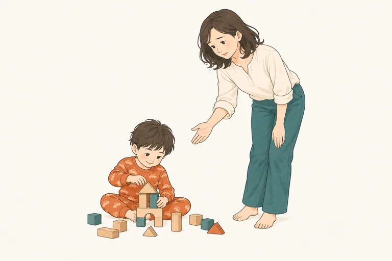 遊びを続ける子どもに声をかけるお母さん